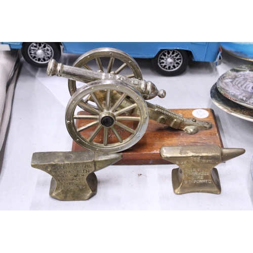 226 - A GEORGIAN CANON AND TWO SMALL BRASS ANVILS