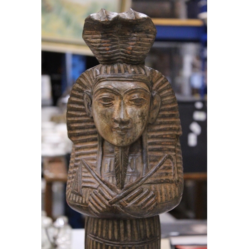 228 - A LARGE EGYPTIAN CARVED WOODEN STATUE, HEIGHT 57CM