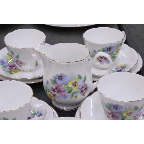 245 - A BONE CHINA TEASET WITH PANSY PATTERN TO INCLUDE A CAKE PLATE, CREAM JUG, SUGAR BOWL CUPS, SAUCERS ... 