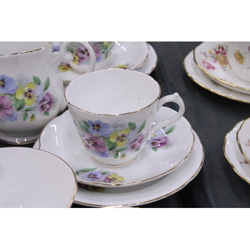 245 - A BONE CHINA TEASET WITH PANSY PATTERN TO INCLUDE A CAKE PLATE, CREAM JUG, SUGAR BOWL CUPS, SAUCERS ... 