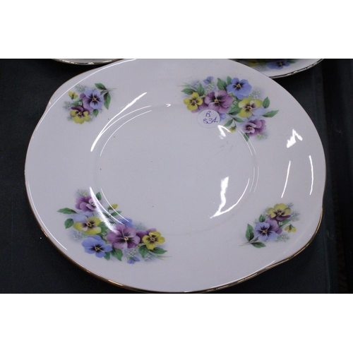 245 - A BONE CHINA TEASET WITH PANSY PATTERN TO INCLUDE A CAKE PLATE, CREAM JUG, SUGAR BOWL CUPS, SAUCERS ... 