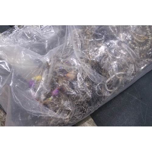 63 - A 2.5 KG BAG OF JEWELLERY TO INCLUDE GOLD PLATED AND  WHITE METAL CHAINS