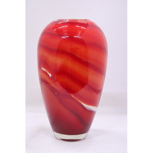 83 - A RED, ORANGE AND WHITE HEAVY GLASS VASE WITH A WHITE INTERIOR