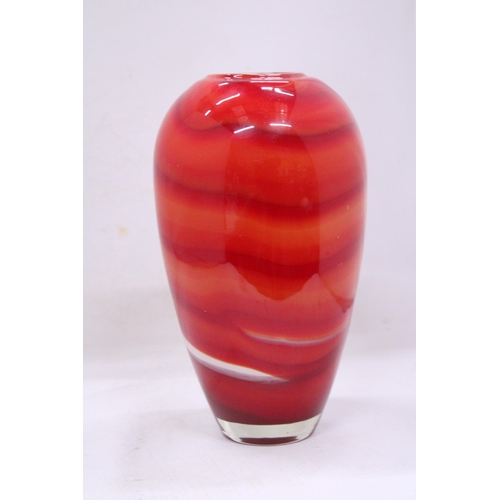 83 - A RED, ORANGE AND WHITE HEAVY GLASS VASE WITH A WHITE INTERIOR