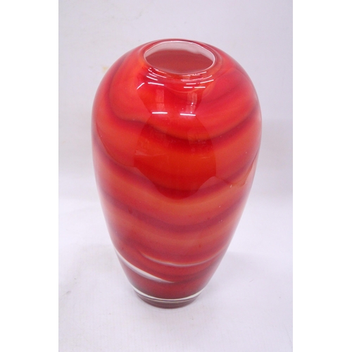 83 - A RED, ORANGE AND WHITE HEAVY GLASS VASE WITH A WHITE INTERIOR