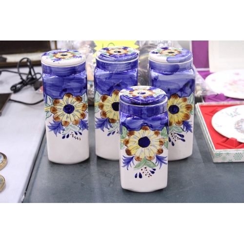 86 - FOUR CERAMIC HANDPAINTED STORAGE JARS