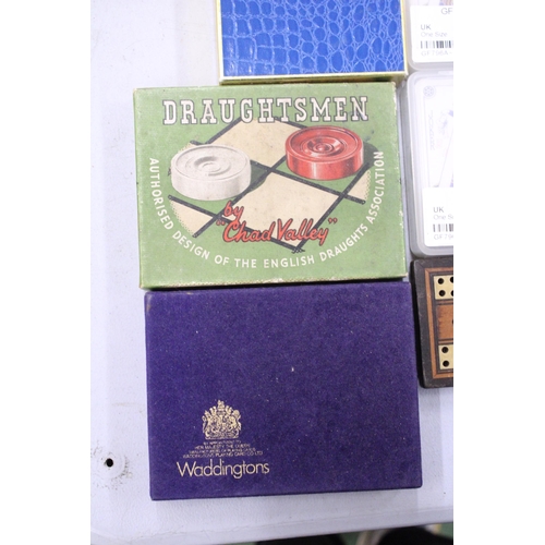 91 - A COLLECTION OF VINTAGE GAMES TO INCLUDE DRAUGHTS, CARDS, CRIBBAGE BOARD, CARDS, ETC.,