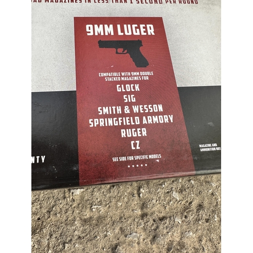 3910 - TWO BOXED MAG PUMPS 9MM LUGER