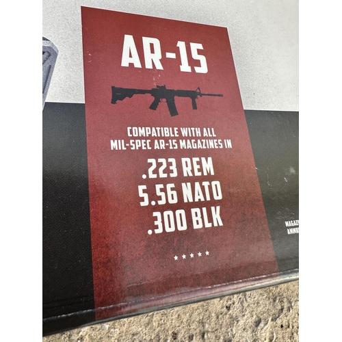 3911 - TWO BOXED MAG PUMPS AR-15