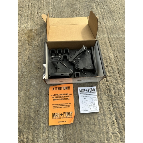 3913 - TWO BOXED MAG PUMPS AR-15 AND A 9MM LUGER