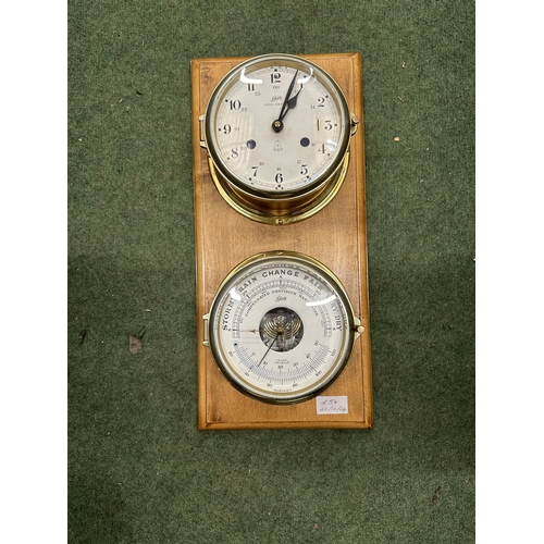 45A - A VINTAGE SCHATZ BRASS ROYAL MARINER SHIP CLOCK AND BAROMETER ON A WOODEN STAND