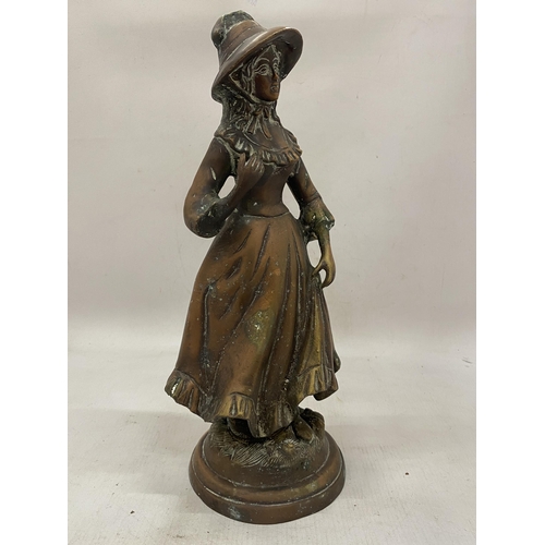 12 - A HEAVY BRONZE FIGURE OF A GIRL WEARING A BONNET - 36 CM(H)