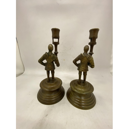 24 - A PAIR OF FRENCH BRASS MEDIEVAL PAW GUARD CANDLESTICK HOLDERS