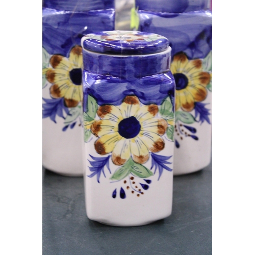 86 - FOUR CERAMIC HANDPAINTED STORAGE JARS