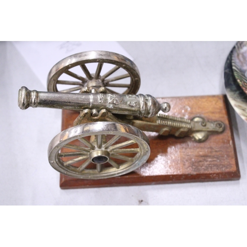 226 - A GEORGIAN CANON AND TWO SMALL BRASS ANVILS