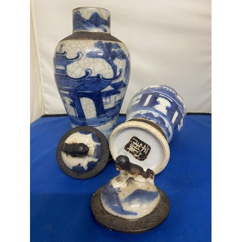 301 - A PAIR OF ANTIQUE CHINESE CRACKLE WARE VASES DECORATED WITH A BLUE PAINTED LANDSCAPE WITH A DARK BRO... 