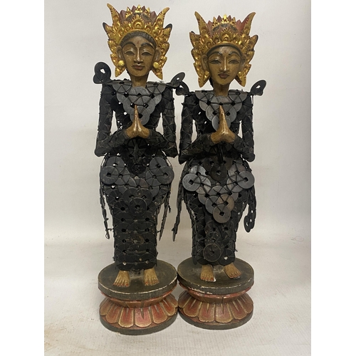 303 - A PAIR OF BALINESE TRIBAL FIGURES ON WOODEN LOTUS THRONES THEIR BODIES CONSTRUCTED FROM CHINESE COIN... 