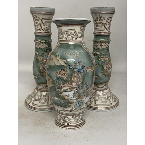 315 - A VINTAGE CHINESE ENAMELLED PORCELAIN VASE TOGETHER WITH A PAIR OF MATCHING CANDLESTICKS BOTH WITH R... 