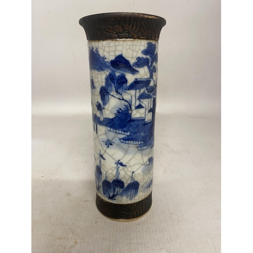 317 - A CHINESE BLUE AND WHITE CRACKLE GLAZE VASE WITH LANDSCAPE SCENE WITH SIGNATURE TO BASE - 20 CM (RIM... 