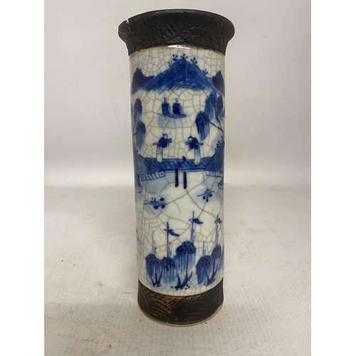 317 - A CHINESE BLUE AND WHITE CRACKLE GLAZE VASE WITH LANDSCAPE SCENE WITH SIGNATURE TO BASE - 20 CM (RIM... 