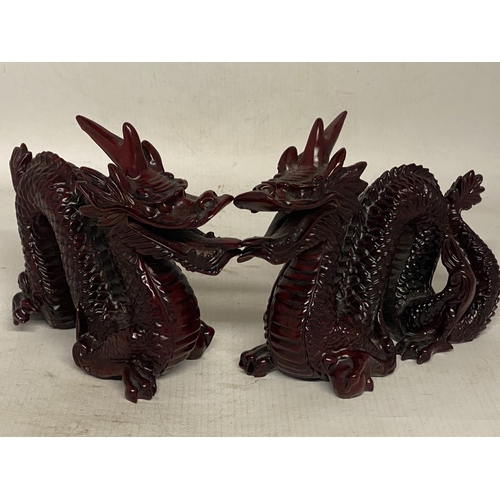 341 - A PAIR OF CHINESE RED DRAGON SCULPTURES