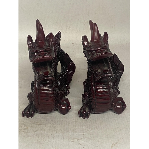 341 - A PAIR OF CHINESE RED DRAGON SCULPTURES