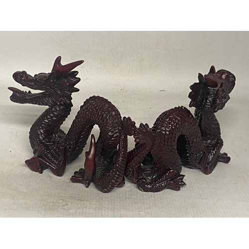 341 - A PAIR OF CHINESE RED DRAGON SCULPTURES