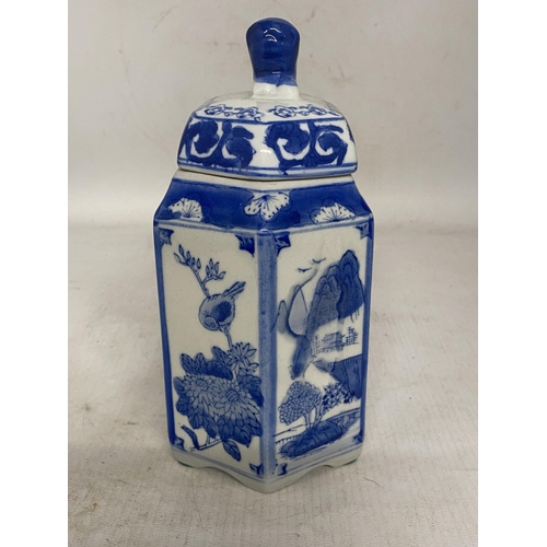 344 - A PORCELAIN CHINESE HEXAGONAL TEA CADDY WITH FOO DOG FINIAL