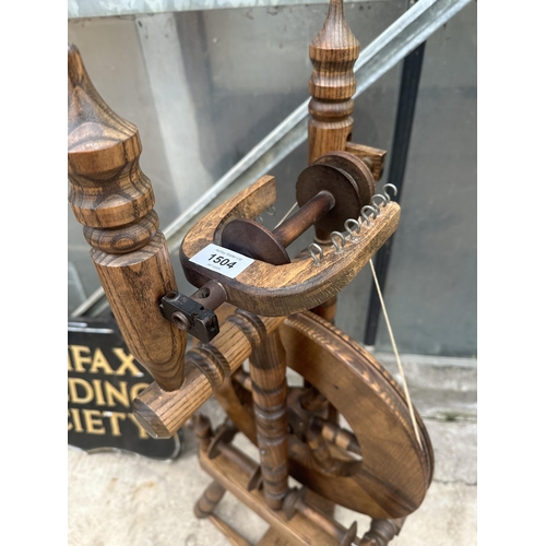 1504 - A VINTAGE WOODEN SPINNING WHEEL