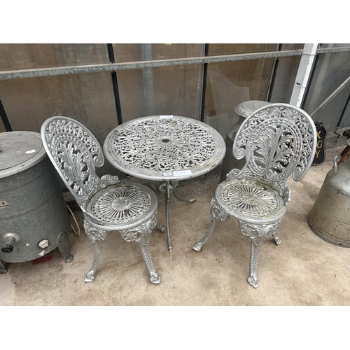 1508 - A CAST ALLOY BISTRO SET COMPRISING OF A ROUND TABLE AND TWO CHAIRS