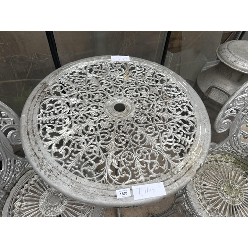 1508 - A CAST ALLOY BISTRO SET COMPRISING OF A ROUND TABLE AND TWO CHAIRS