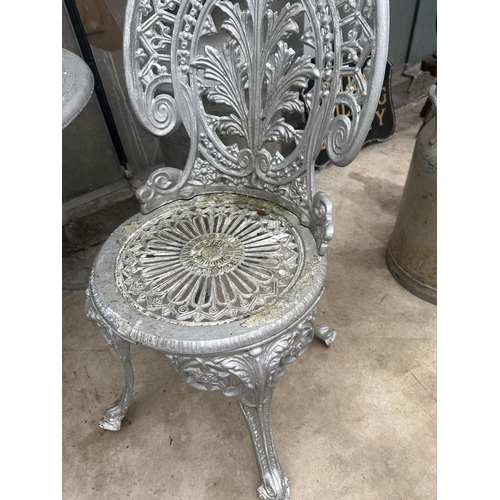 1508 - A CAST ALLOY BISTRO SET COMPRISING OF A ROUND TABLE AND TWO CHAIRS