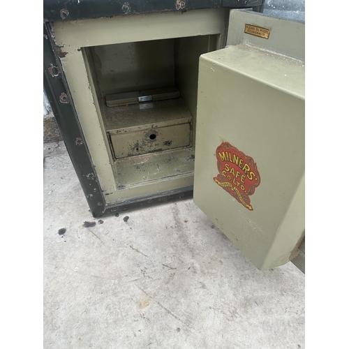 1510 - A HEAVY DUTY MILNERS SAFE COMPLETE WITH KEY