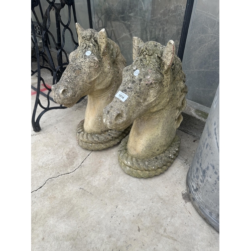 1514 - A PAIR OF CONCRETE HORSE HEAD GARDEN FIGURES