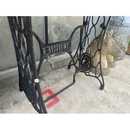 1515 - A CONSOLE TABLE FORMED WITH A SINGER TREADLE BASE AND A MARBLE TOP