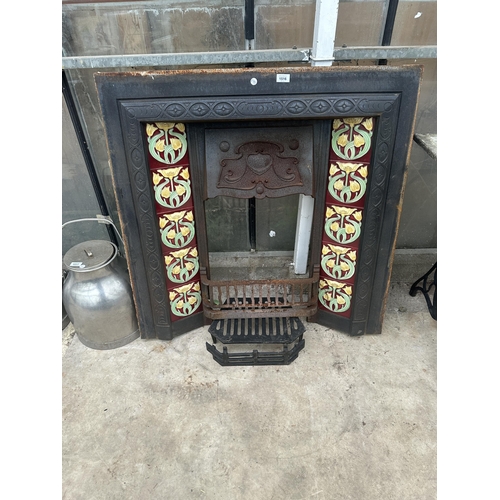 1516 - A DECORATIVE VINTAGE CAST IRON FIRE SURROUND WITH TILED SIDES