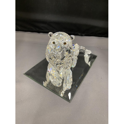 21 - A LARGE SWAROVSKI CRYSTAL LION ON A MIRRORED BASE