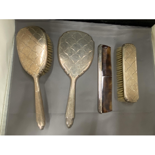 27 - A BOXED HALLMARKED BIRMINGHAM SILVER FOUR PIECE SET TO INCLUDE HAIRBRUSH, MIRROR, COMB AND CLOTHES B... 