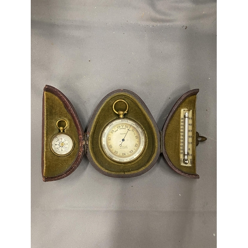 29 - A VINTAGE POCKET CASED SET CONTAINING A BAROMETER, COMPASS AND THERMOMETER MARKED A & N.C.S.LTD WEST... 