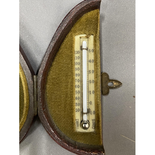 29 - A VINTAGE POCKET CASED SET CONTAINING A BAROMETER, COMPASS AND THERMOMETER MARKED A & N.C.S.LTD WEST... 