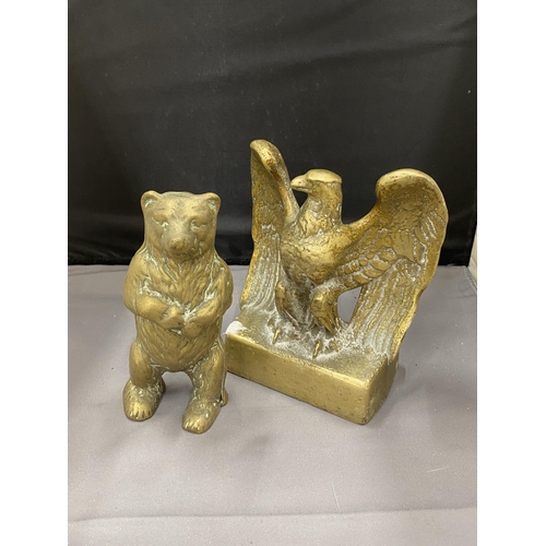 36 - TWO BRASS ITEMS TO INCLUDE A STANDING BEAR MONEY BOX AND AN EAGLE