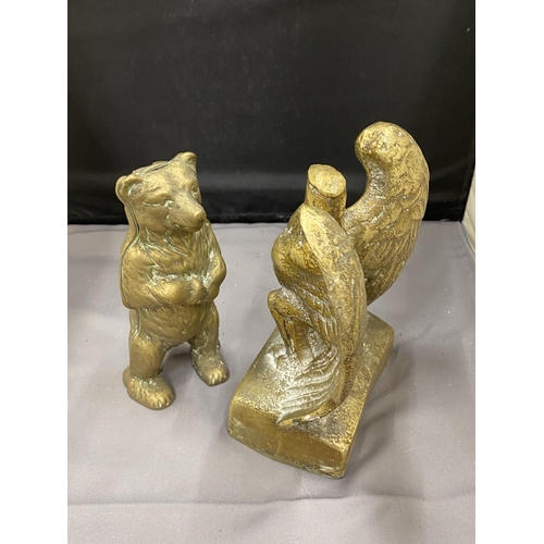 36 - TWO BRASS ITEMS TO INCLUDE A STANDING BEAR MONEY BOX AND AN EAGLE