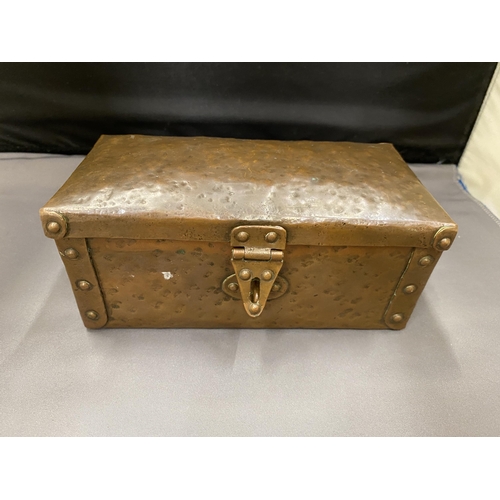 4 - AN ARTS AND CRAFTS HAMMERED COPPER AND RIVETED TRUNK STYLE BOX 16CM LONG