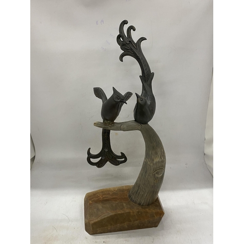 44A - A PAIR OF SPELTER BIRDS ON AN ONYX BASE WITH HORN TREE