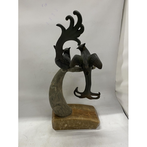 44A - A PAIR OF SPELTER BIRDS ON AN ONYX BASE WITH HORN TREE