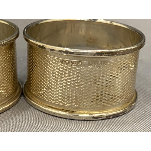 6A - SEVEN VARIOUS HALLMARKED SILVER NAPKIN RINGS TO INCLUDE TWO PAIRS OF BIRMINGHAM, A CHESTER, LONDON  ... 