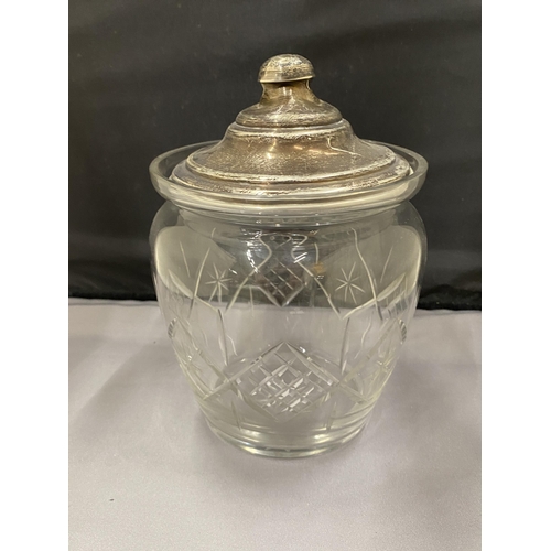 7 - A CUT GLASS JAR WITH A HALLMARKED BIRMINGHAM SILVER LID