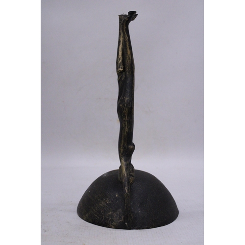 130 - A VINTAGE CAST IRON PAL-BELL DANCER SCULPTURE