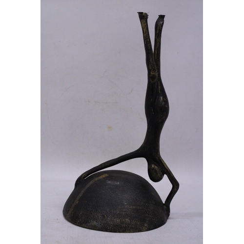 130 - A VINTAGE CAST IRON PAL-BELL DANCER SCULPTURE