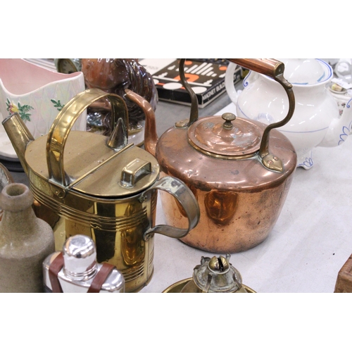 148 - A BRASS KETTLE AND A COPPER KETTLE, BRASS BASE FOR AN OIL LAMP, VINTAGE STONE BOTTLE AND A LEATHER C... 